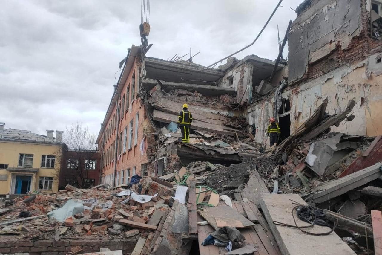 Ukrainian rescuers check the remains of a school in Chernihiv.