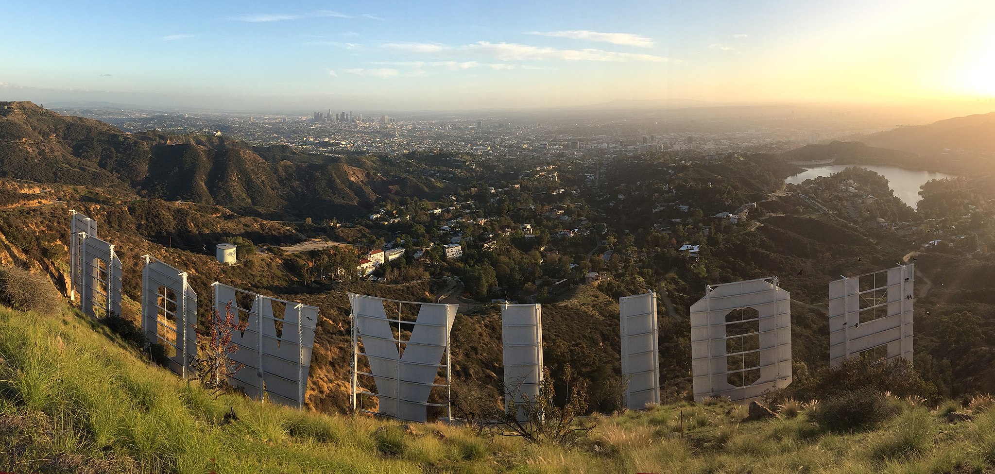 A picture of the Hollywood sign from behind and above the sign looking out over Los Angeles.