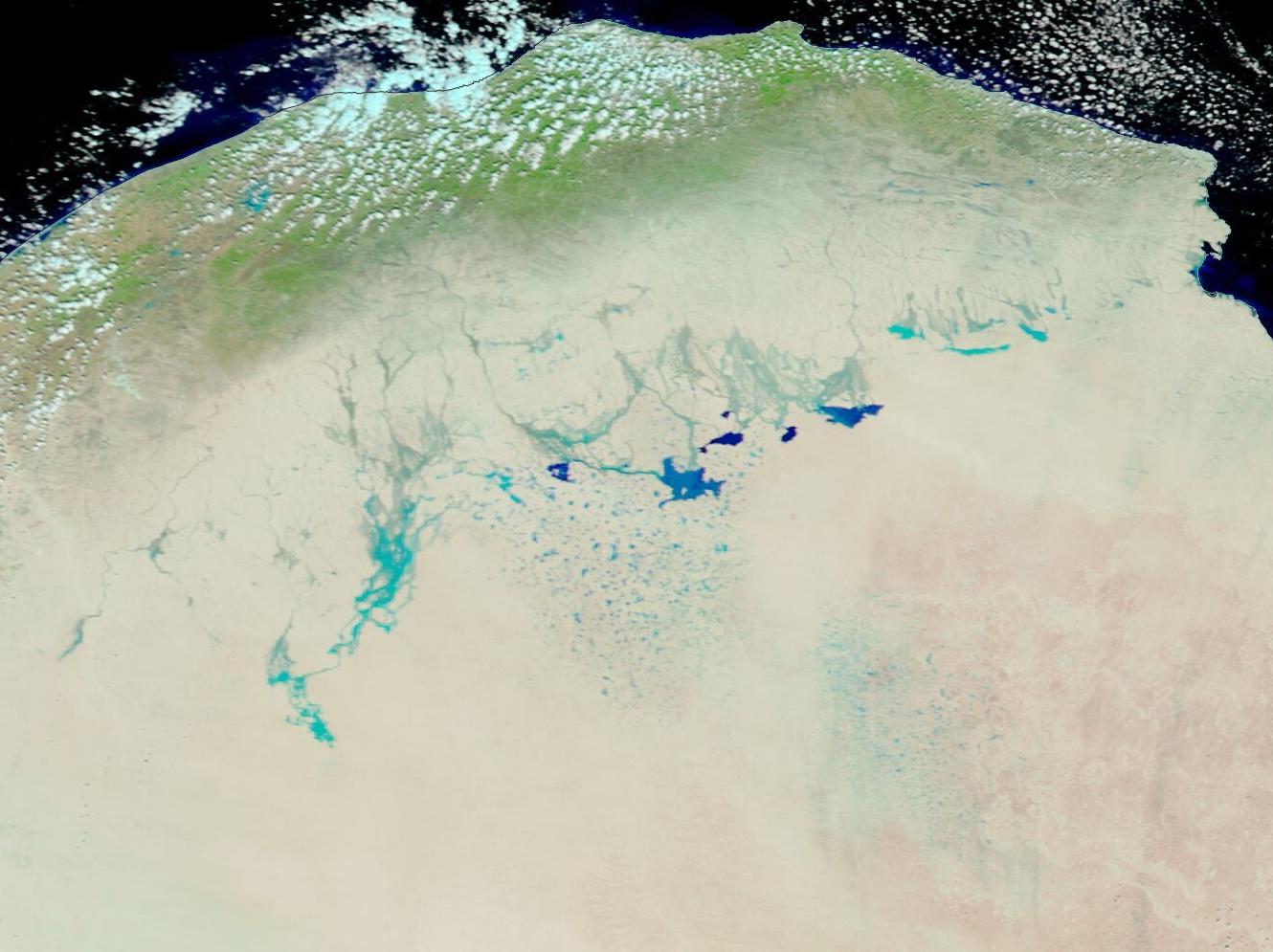A satellite image of northeastern Libya after a severe storm left major water deposits seen throughout the natural map.